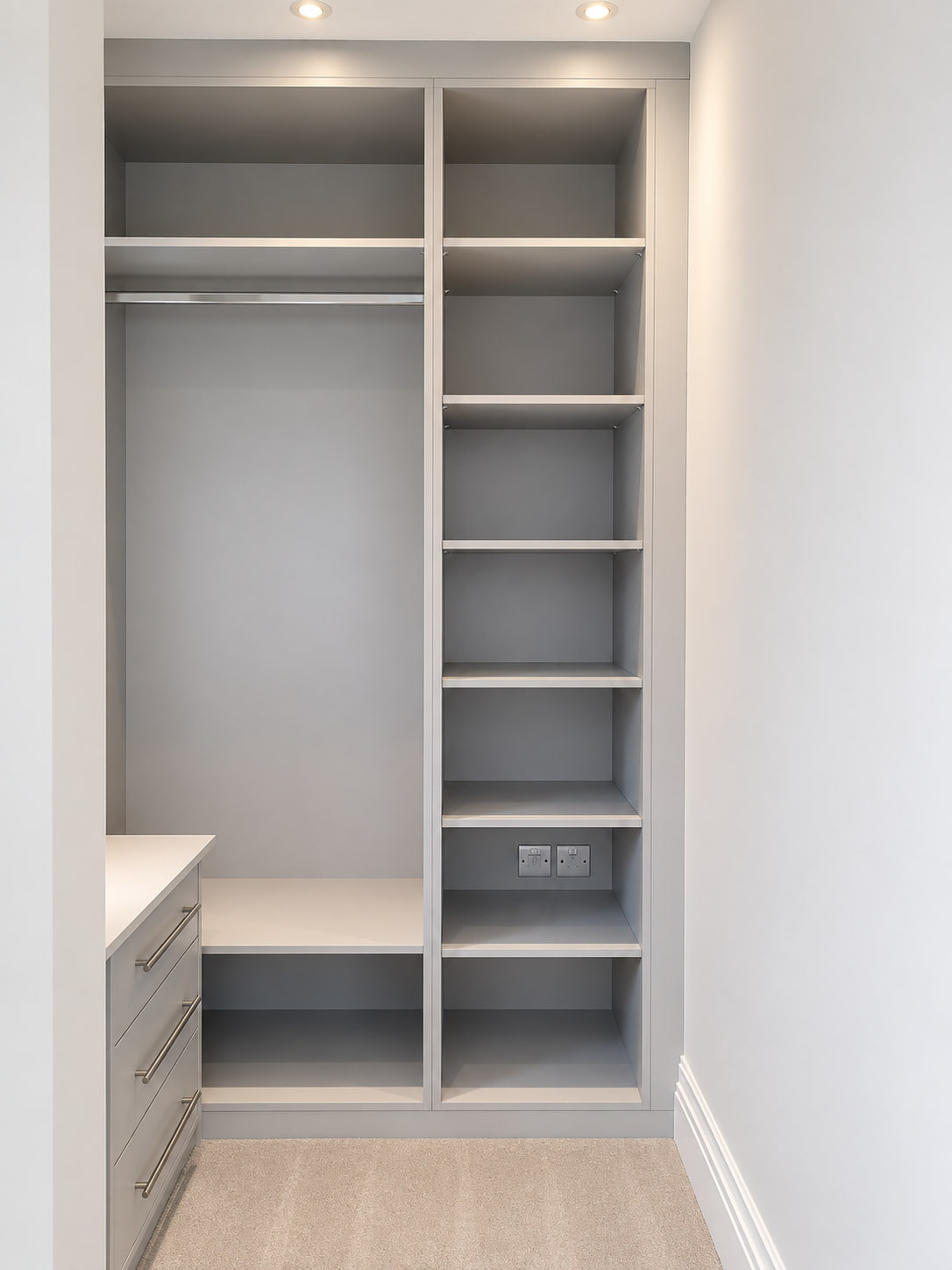 Grey open walk-in wardrobe with hanging and shelves