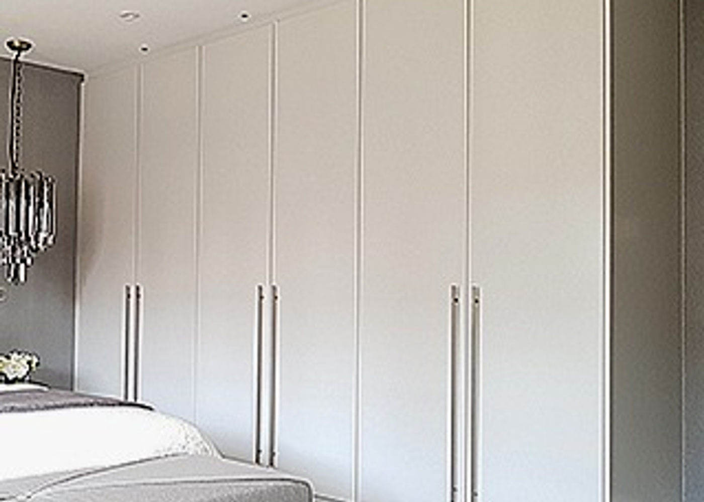 Completed made-to-measure fitted wardrobe with hinged panel doors