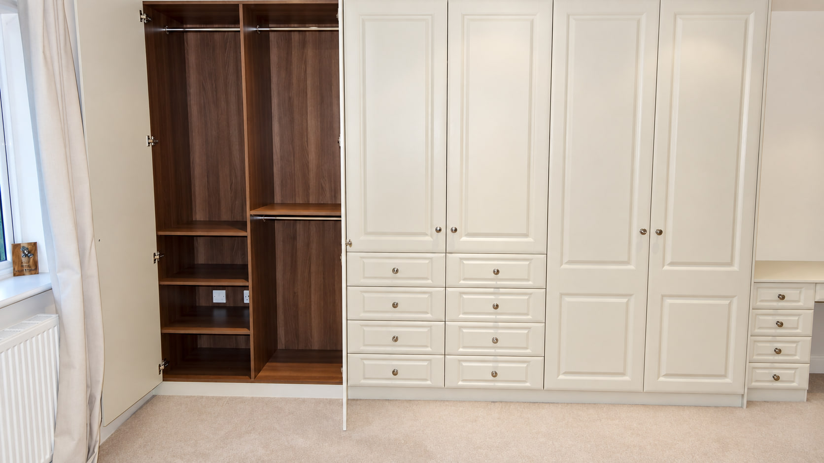 Classic cream wardrobe with contrasting dark interior