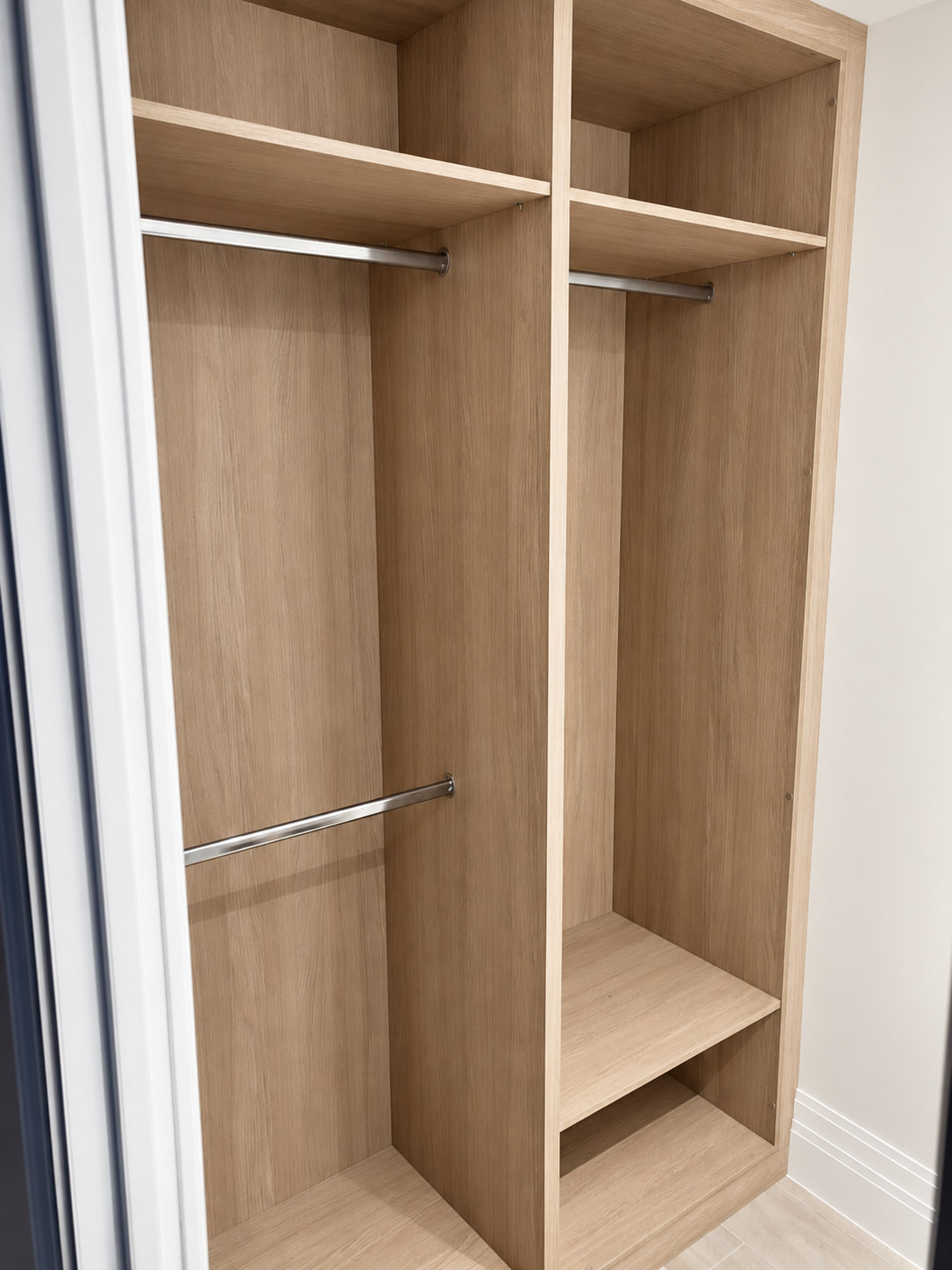 Light woodgrain walk-in wardrobe with double hanging