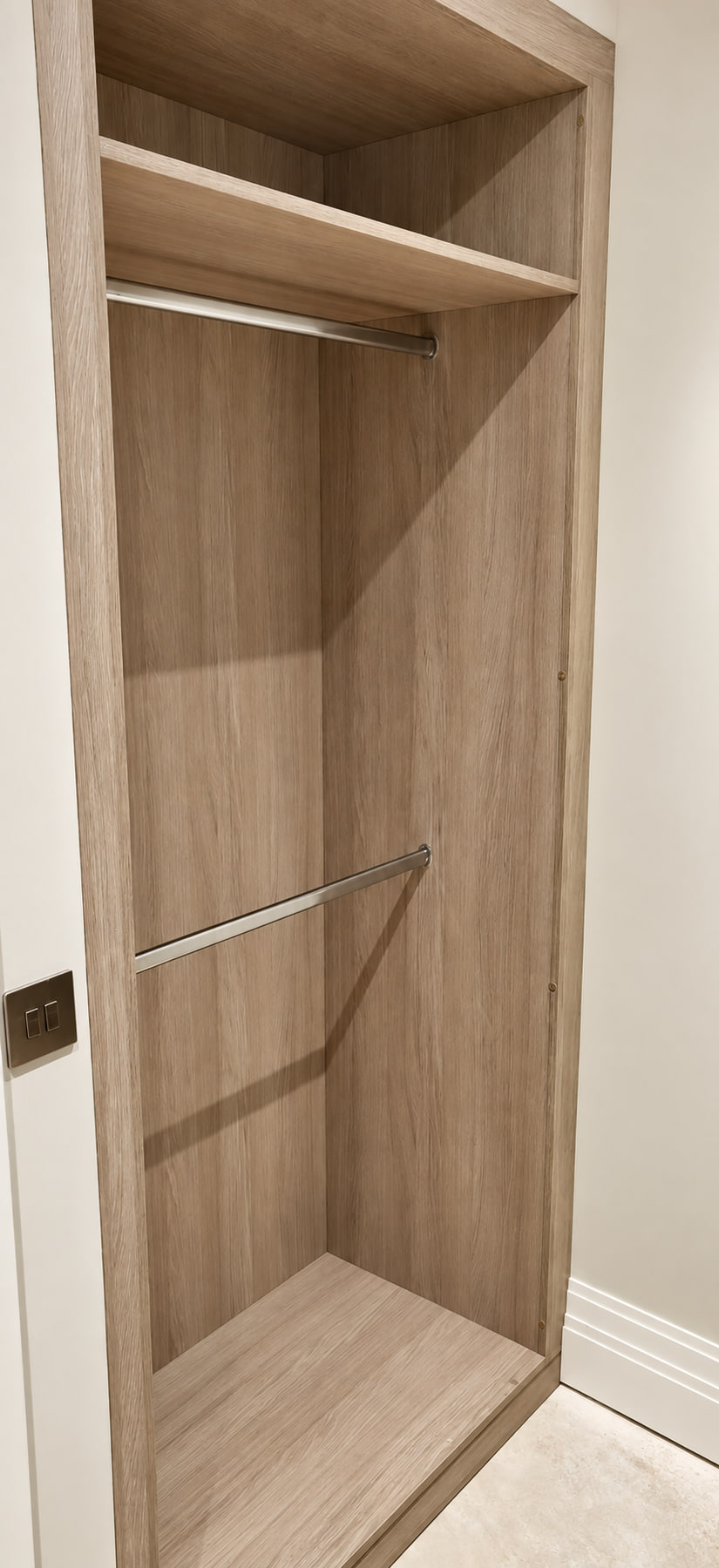 Single light woodgrain wardrobe bay with two hanging rails