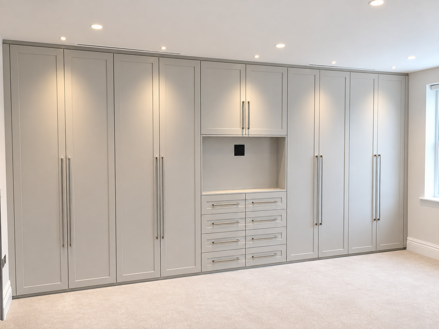 Wall-to-wall white shaker fitted wardrobe with drawers