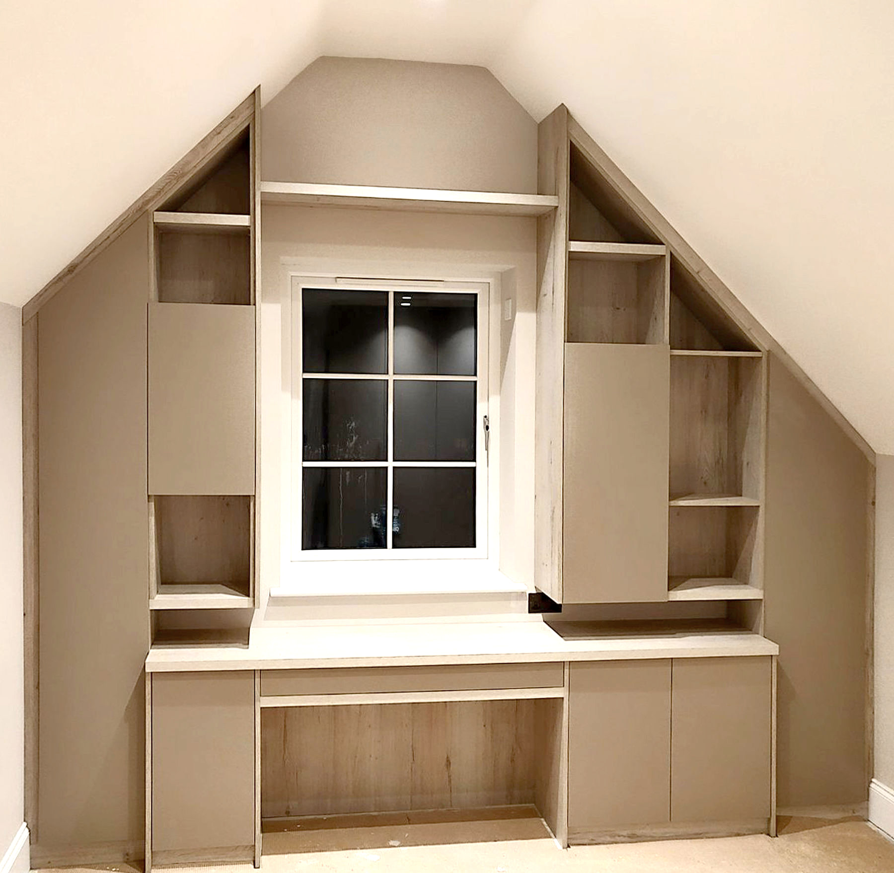 Fitted home office beneath a sloping ceiling