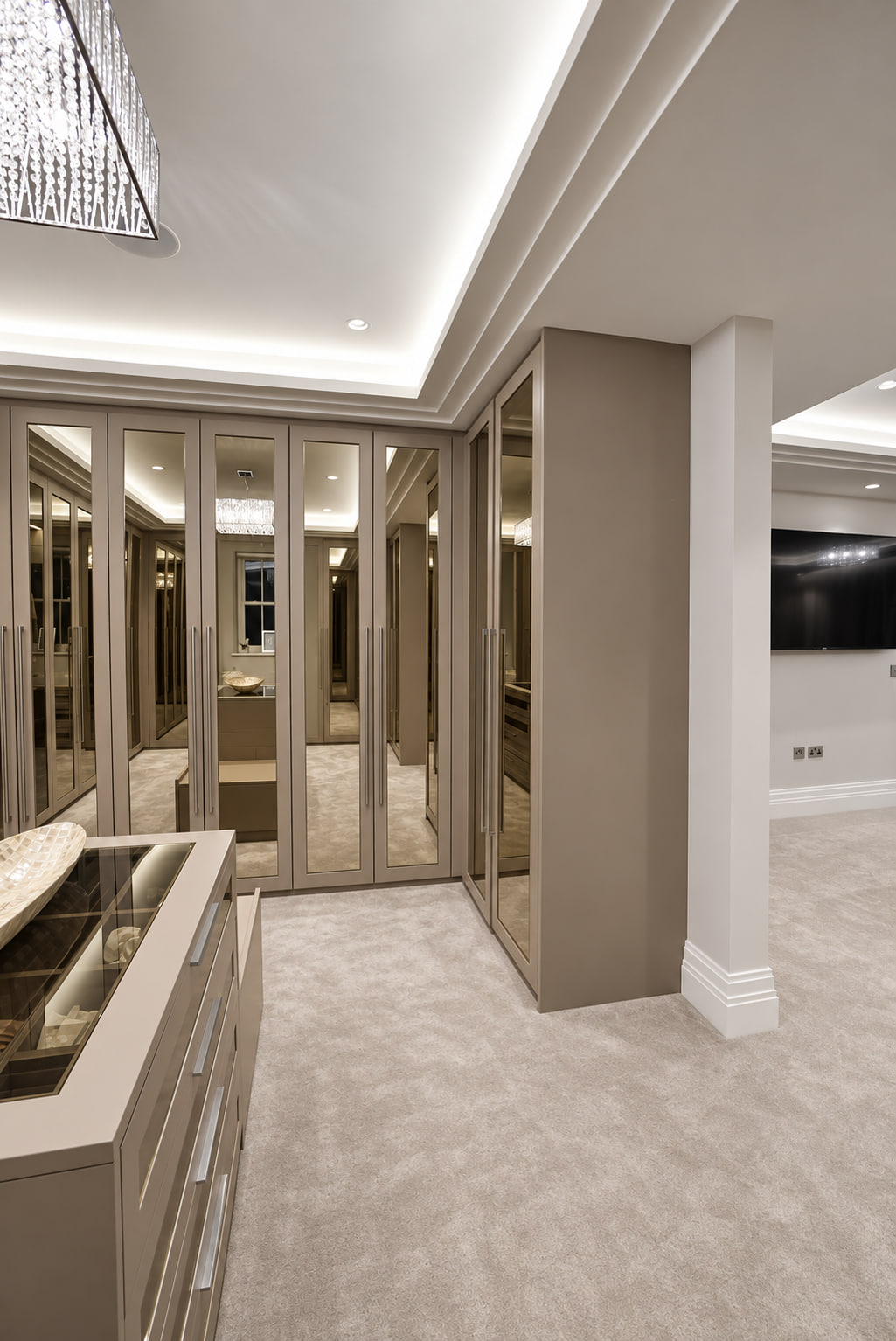 Glass-topped island in a mirrored dressing room